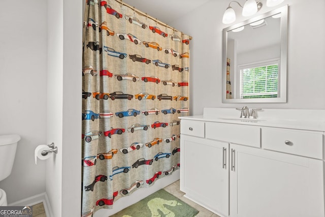 1606 Chancery Ln, Lithia Springs, GA 30122 - bathroom with toilet, tile patterned floors, a shower with shower curtain, and vanity