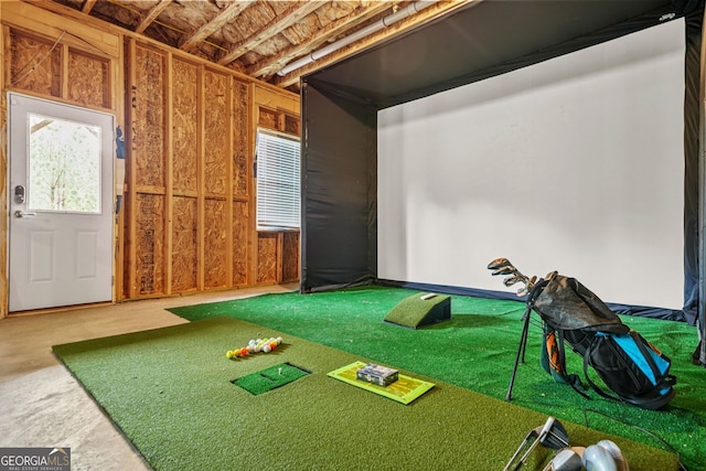 1606 Chancery Ln, Lithia Springs, GA 30122 - game room with an area to practice putting and golf simulator