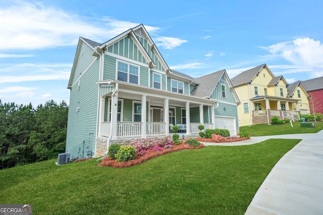 1606 Chancery Ln, Lithia Springs, GA 30122 - craftsman inspired home with covered porch, board and batten siding, a garage, central air condition unit, and a front lawn