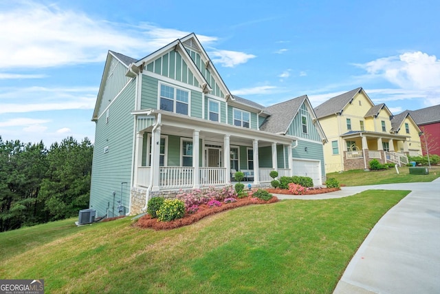 1606 Chancery Ln, Lithia Springs, GA 30122 - craftsman inspired home with a porch, a garage, board and batten siding, and central AC unit