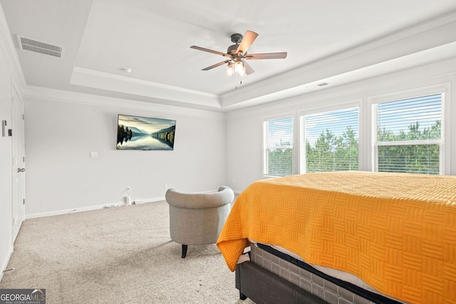 1606 Chancery Ln, Lithia Springs, GA 30122 - bedroom featuring a raised ceiling, carpet floors, baseboards, crown molding, and a ceiling fan