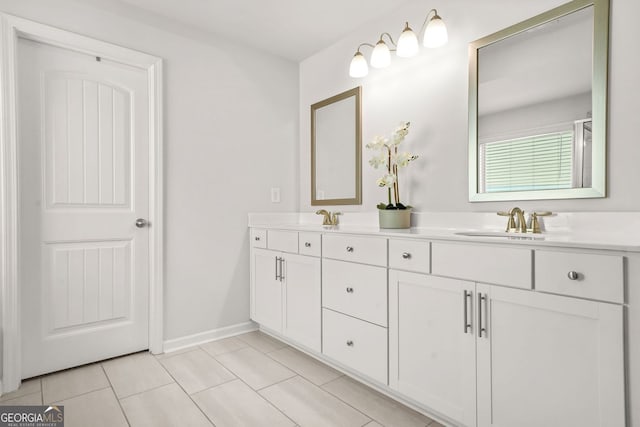 1606 Chancery Ln, Lithia Springs, GA 30122 - full bath featuring double vanity, tile patterned floors, and baseboards