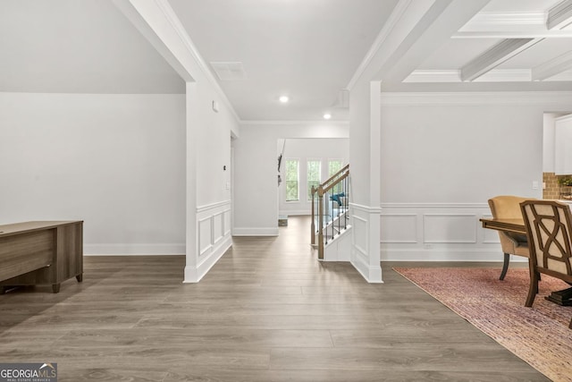 1606 Chancery Ln, Lithia Springs, GA 30122 - corridor with crown molding, wood finished floors, recessed lighting, a decorative wall, and wainscoting
