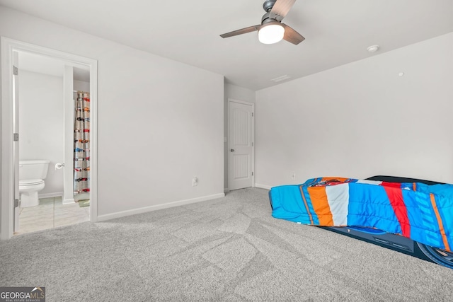 1606 Chancery Ln, Lithia Springs, GA 30122 - unfurnished bedroom featuring carpet flooring, baseboards, ensuite bath, and a ceiling fan