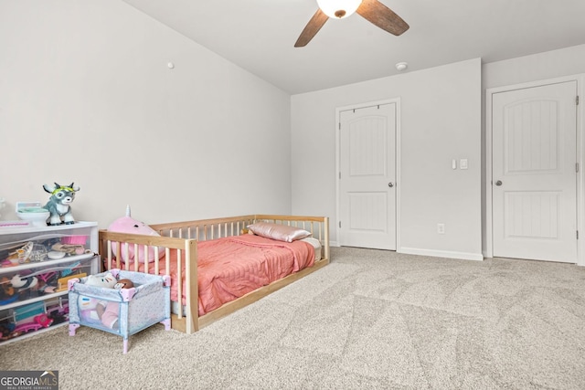 1606 Chancery Ln, Lithia Springs, GA 30122 - carpeted bedroom with baseboards and a ceiling fan
