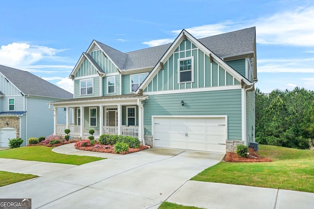 1606 Chancery Ln, Lithia Springs, GA 30122 - craftsman-style house with a porch, board and batten siding, concrete driveway, and a front lawn