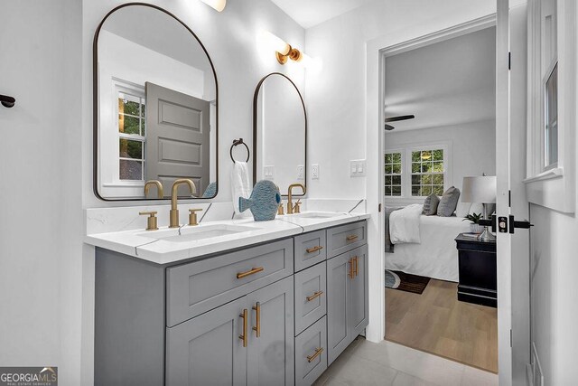 3182 Wakefield Dr, Decatur, GA 30034 - bathroom featuring a ceiling fan, double vanity, ensuite bathroom, and a sink