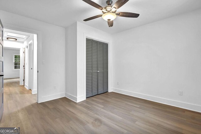 3182 Wakefield Dr, Decatur, GA 30034 - unfurnished bedroom featuring wood finished floors, ceiling fan, baseboards, and a closet