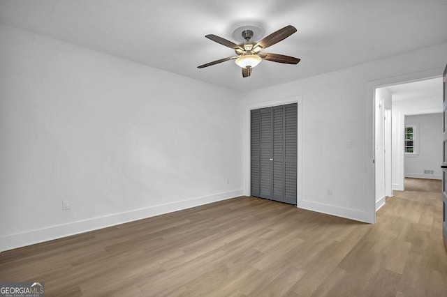 3182 Wakefield Dr, Decatur, GA 30034 - unfurnished bedroom with wood finished floors, ceiling fan, a closet, and baseboards