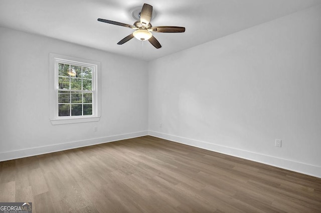 3182 Wakefield Dr, Decatur, GA 30034 - spare room with dark wood-style floors, a ceiling fan, and baseboards