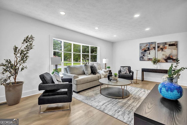 3182 Wakefield Dr, Decatur, GA 30034 - living room with recessed lighting, a textured ceiling, wood finished floors, and baseboards