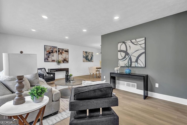 3182 Wakefield Dr, Decatur, GA 30034 - living room with visible vents, recessed lighting, light wood-style flooring, and baseboards