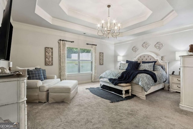 carpeted bedroom featuring crown molding, an inviting chandelier, and a tray ceiling