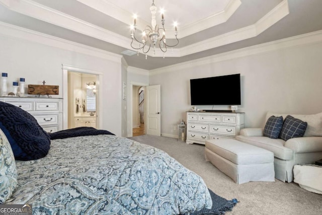 carpeted bedroom with ensuite bath, visible vents, a notable chandelier, crown molding, and a tray ceiling