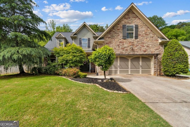 view of front of property featuring a garage, a front yard, concrete driveway, and stone siding