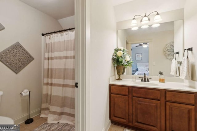 ensuite bathroom with toilet, vanity, ensuite bathroom, and tile patterned flooring