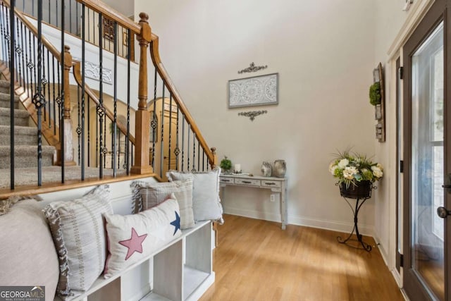 interior space featuring wood finished floors and baseboards