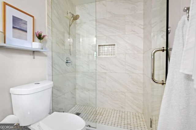 full bathroom with a shower stall and toilet