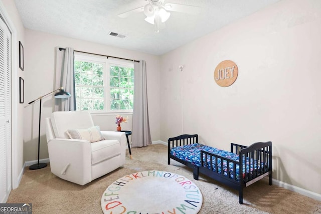 bedroom with visible vents, carpet flooring, baseboards, and a ceiling fan