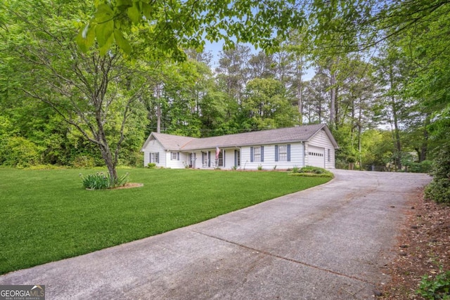 ranch-style house with driveway and a front yard