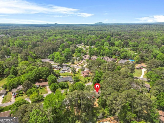 aerial view featuring a view of trees