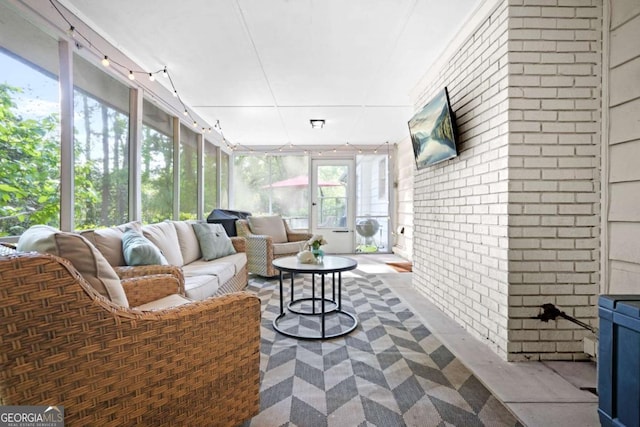 sunroom with an outdoor hangout area