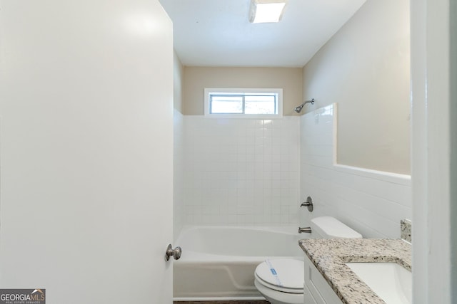 bathroom featuring vanity, toilet, and shower / washtub combination