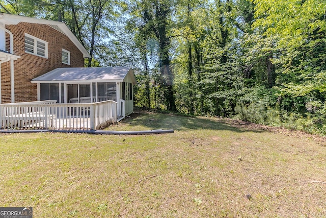 view of yard with a sunroom