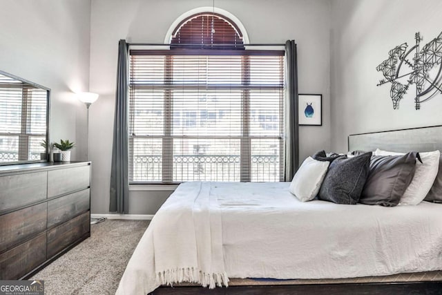 carpeted bedroom with baseboards