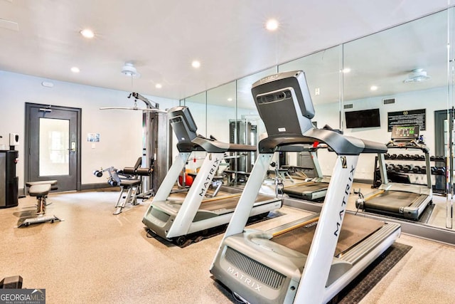 gym featuring baseboards and recessed lighting