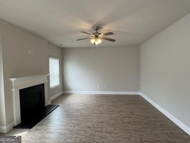 3592 Hancock Vw, Decatur, GA 30034 - unfurnished living room with baseboards, wood finished floors, ceiling fan, and a fireplace with raised hearth