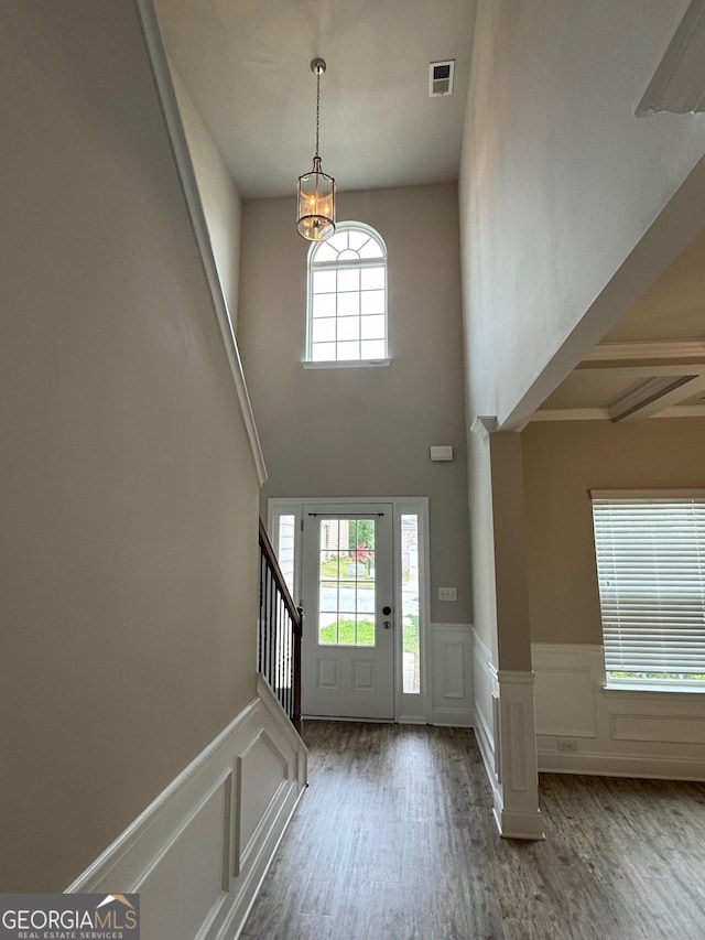 3592 Hancock Vw, Decatur, GA 30034 - entryway featuring wood finished floors, stairs, a decorative wall, wainscoting, and visible vents