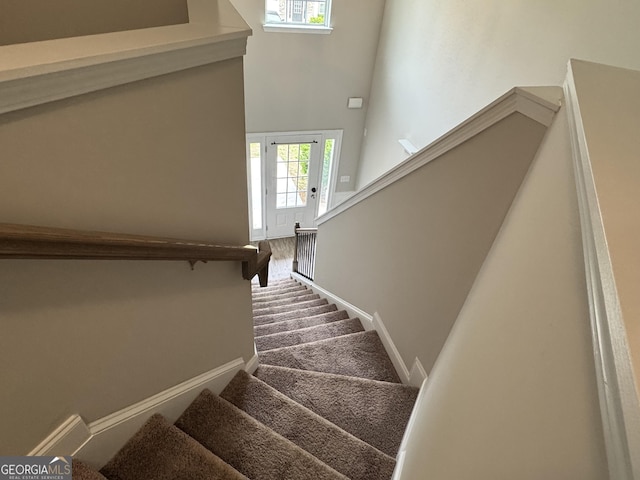 3592 Hancock Vw, Decatur, GA 30034 - stairway with a towering ceiling, baseboards, and carpet floors