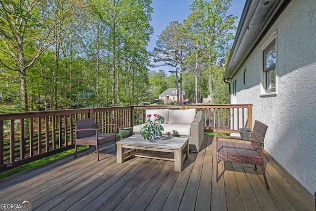 wooden deck with an outdoor hangout area