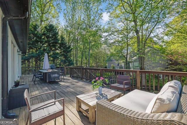 wooden deck featuring outdoor dining space