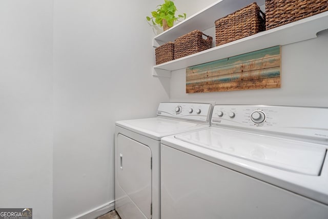 clothes washing area featuring laundry area and washing machine and clothes dryer