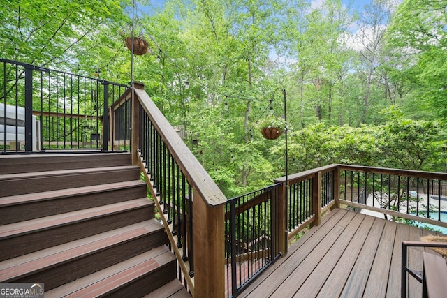 wooden terrace featuring stairway