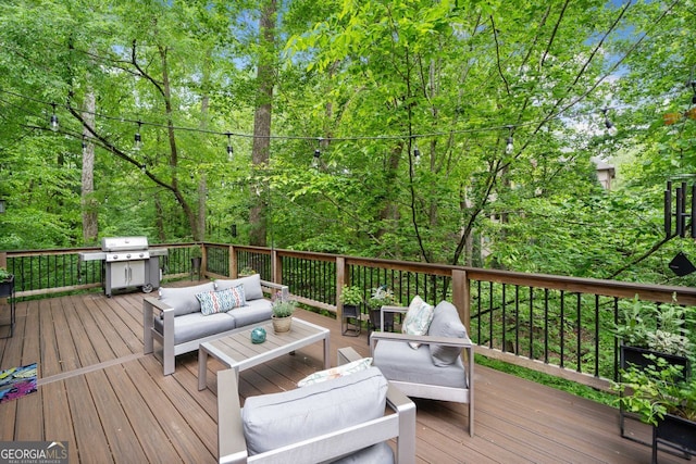 wooden terrace with grilling area and outdoor lounge area