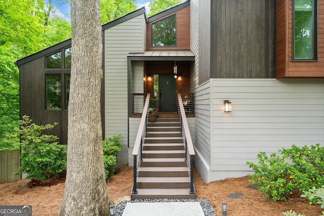 entrance to property featuring fence