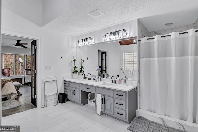 4220 Chapel Hill Farms Dr, Douglasville, GA 30135 - ensuite bathroom featuring double vanity, a textured ceiling, a ceiling fan, and a shower with curtain