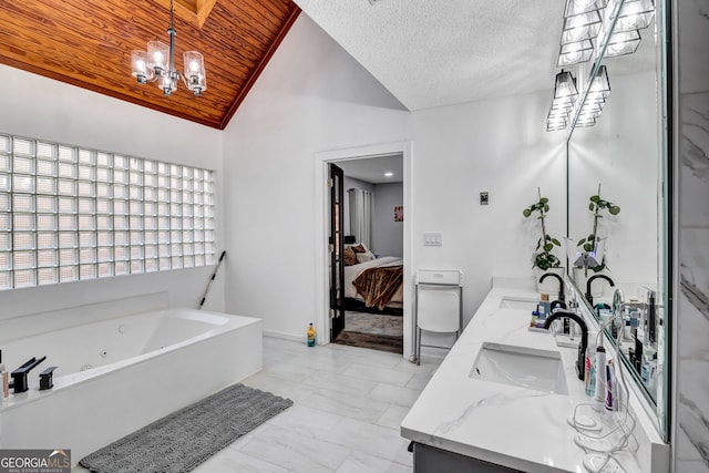 4220 Chapel Hill Farms Dr, Douglasville, GA 30135 - ensuite bathroom with lofted ceiling, double vanity, a jetted tub, marble finish floors, and a chandelier