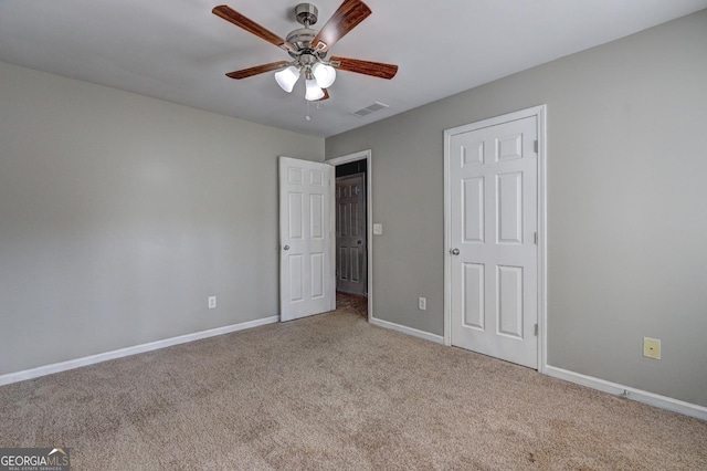 unfurnished bedroom featuring visible vents, ceiling fan, carpet floors, and baseboards