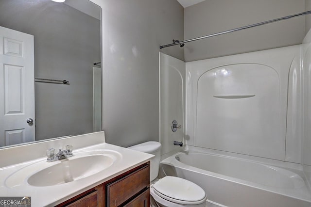 full bath featuring toilet, bathtub / shower combination, and vanity