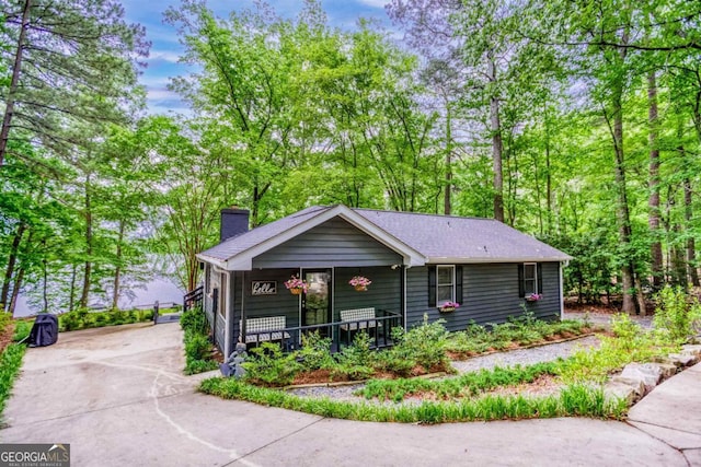 1860 Apalachee Woods Trl, Buckhead, GA 30625 - view of front of property featuring a chimney, covered porch, and concrete driveway