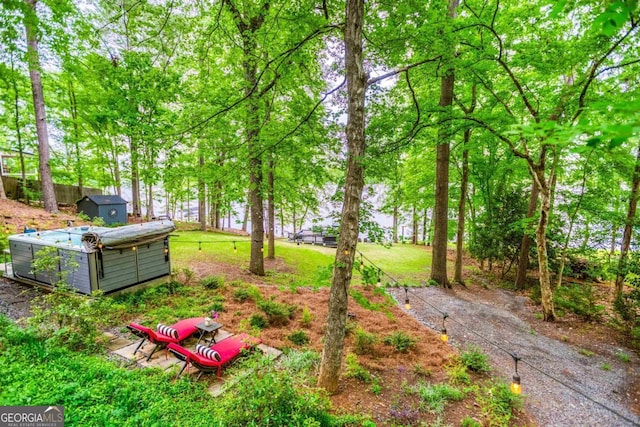 1860 Apalachee Woods Trl, Buckhead, GA 30625 - view of yard with a storage unit and an outdoor structure