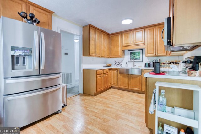 1860 Apalachee Woods Trl, Buckhead, GA 30625 - kitchen featuring a sink, visible vents, stainless steel appliances, light countertops, and light wood finished floors