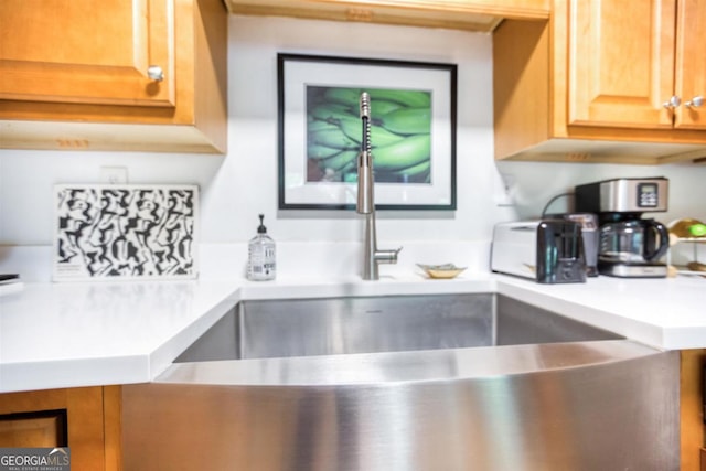 1860 Apalachee Woods Trl, Buckhead, GA 30625 - details with light brown cabinetry, a sink, and light countertops