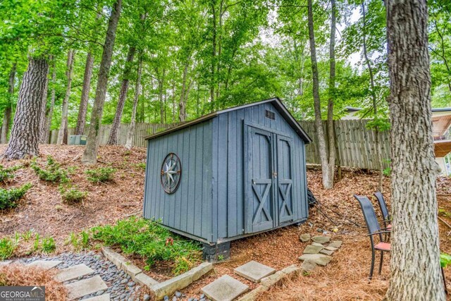 1860 Apalachee Woods Trl, Buckhead, GA 30625 - view of shed with fence