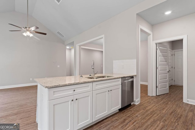 kitchen featuring ceiling fan, dishwasher, a sink, white cabinetry, and a peninsula