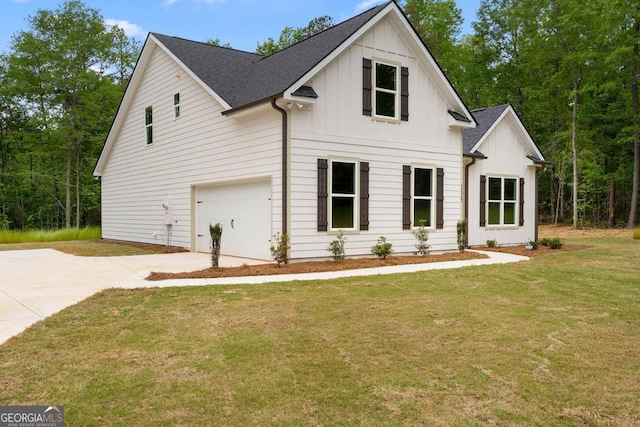 modern inspired farmhouse featuring driveway, board and batten siding, a front yard, and a garage